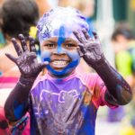 This little girl gives an entirely new meaning to finger painting at the 2016 Muddy Puddles Mess Fest, July 30th at Kiwi Country Day Camp.